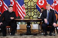 US President Donald Trump (R) and North Korea's leader Kim Jong Un hold a meeting during the second US-North Korea summit at the Sofitel Legend Metropole hotel in Hanoi on February 28, 2019. (Photo by Saul LOEB / AFP)