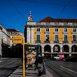 A woman wearing a face mask waits for a bus at Comercio square in Lisbon on January 7, 2021. - Portugal reported a record 10,000 new coronavirus cases in 24 hours yesterday, and the government warned that its hospitals were under "enormous pressure" from the resurgence of the pandemic. (Photo by PATRICIA DE MELO MOREIRA / AFP)