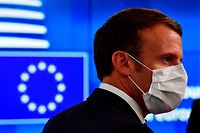 France's President Emmanuel Macron arrives for a meeting of an EU summit on a coronavirus recovery package at the European Council building in Brussels on July 19, 2020 - An acrimonious EU summit headed into a third day as leaders remained deadlocked over a huge post-coronavirus economic recovery plan, unable to overcome fierce resistance from the Netherlands and its "frugal" allies. (Photo by JOHN THYS / POOL / AFP)
