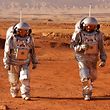 Astronauts from a team from Europe and Israel walk in spacesuits during a training mission for Mars at a site that simulates an off-site station at the Ramon Crater in Mitzpe Ramon, Israel's southern Negev desert, on October 10, 2021.  - Six astronauts from Portugal, Spain, Germany, the Netherlands, Austria and Israel will be separated from Earth for a month between October 4-31, only to leave their habitat in Mars-like spacesuits.  Their mission, the AMADEE-20 Mars simulation, will be operated by a Mars terrestrial analog and a dedicated mission support center in Austria to conduct tests ahead of future human and robotic Mars exploration missions.  (Photo by Jacques Guez/AFP)