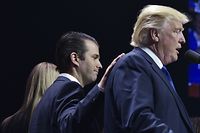 (FILES) This file photo taken on November 7, 2016 shows Donald Trump, Jr., (L) as he places a hand on the shoulder of his father, former Republican presidential nominee Donald Trump, during in a rally on the final night of the 2016 US presidential election at the SNHU Arena in Manchester, New Hampshire.
Donald Trump's eldest son on July 10, 2017 admitted meeting a Russian lawyer to get dirt on his father's 2016 rival Hillary Clinton, thrusting the White House deep into another Russia-related scandal. Trump junior confirmed reports that he was on the trail of damaging information on the Democrat vying to become America's first woman president, when he met Natalia Veselnitskaya in June 2016. / AFP PHOTO / MANDEL NGAN