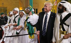 (FILES) In this file photo taken on May 20, 2017, US President Donald Trump joins Saudi Arabia's King Salman bin Abdulaziz al-Saud (3rd L) and other dancers with swords at a welcome ceremony ahead of a banquet at the Murabba Palace in the Saudi capital Riyadh. - Brandishing a sword and dancing to traditional music on his first visit to Saudi Arabia soon after taking office, Donald Trump launched a dramatic relationship revamp that freed the hands of the Gulf monarchies. More than three years on, regional leaders are playing their diplomatic cards in support of an erratic but valuable partner in Washington as he seeks a second term - one that would likely lead to even deeper tensions with Iran and more opportunities for their one-time enemy, Israel. (Photo by MANDEL NGAN / AFP)