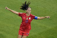 TOPSHOT - United States' forward Alex Morgan (C) celebrates after scoring a goal during the France 2019 Women's World Cup semi-final football match between England and USA, on July 2, 2019, at the Lyon Satdium in Decines-Charpieu, central-eastern France. (Photo by Jean-Philippe KSIAZEK / AFP)