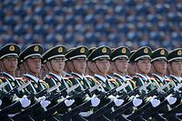 (FILES) This file photo taken on September 04, 2015 shows Chinese soldiers marching in formation during a military parade in Tiananmen Square in Beijing on September 3, 2015, to mark the 70th anniversary of victory over Japan and the end of World War II. 
China continues to arm itself faster than other countries to the point of moving towards near parity with the West in some military areas, according to the annual report of the International Institute for Strategic Studies (IISS) released on February 14, 2017. / AFP PHOTO / POOL / WANG Zhao