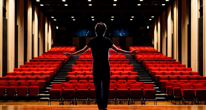 Young actor in a theater.