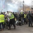 Police forces clash with protestors wearing "yellow vests" (gilets jaunes) on the Champs Elysees in Paris during a protest against rising costs of living they blame on high taxes. - Paris was on high alert on December 8 with major security measures in place ahead of fresh "yellow vest" protests which authorities fear could turn violent for a second weekend in a row. (Photo by Zakaria ABDELKAFI / AFP)