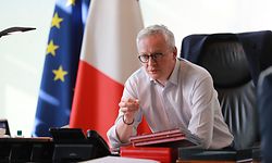 Economy minister Bruno Le Maire speaks with his advisors prior to an Eurogroup meeting, in the minister's office in Paris on april 9, 2020, on the 24rd day of a strict lockdown aimes at curbing the spread of COVID-19, the novel coronavirus. (Photo by Ludovic MARIN / AFP)