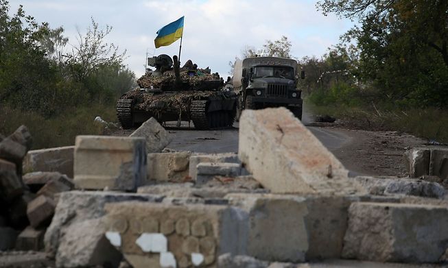 A Ukrainian tank on the road near Dolina village, Donetsk region, on Thursday