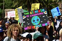 TOPSHOT - Thousands of youth demand action during a Climate Change protest in downtown Los Angeles, California on September 20, 2019, as part of a global protest happening around the world. - Crowds of children skipped school to join a global strike against climate change, heeding the rallying cry of teen activist Greta Thunberg and demanding adults act to stop environmental disaster. It was expected to be the biggest protest ever against the threat posed to the planet by climate change. (Photo by Frederic J. BROWN / AFP)