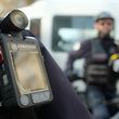A police officer stands guard with a body camera attached to the shoulder on February 15, 2017 in Marseille.
Currently in Marseille, only the Mountain bike brigade of the city center and the Specialised field brigade (BST - Brigade specialisee de terrain) of the northern district are equipped with body cameras. Testing of the cameras began 3 years ago in France. According to th prefect of police of the Bouches-du-Rhone, Laurent Nunez, the body cameras "reduce the tensions during interventions". / AFP PHOTO / BORIS HORVAT
