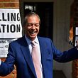 TOPSHOT - Brexit Party leader Nigel Farage gestures as he arrives at a polling station to vote in the European Parliament elections, in Biggin Hill, south east England on May 23, 2019. - Voting got under way in Britain early on Thursday in elections to the European Parliament -- a contest the country had not expected to hold nearly three years after the Brexit referendum. (Photo by Ben STANSALL / AFP)