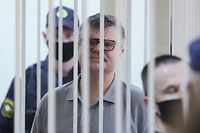 Opposition politician and banker Viktor Babaryko, charged with corruption and money laundering, stands inside a defendants' cage during his sentencing in Minsk on July 6, 2021. - A court in Belarus on July 6 sentenced one of strongman Alexander Lukashenko's leading critics to 14 years in prison on fraud charges. 
Former banker Viktor Babaryko was arrested in June last year ahead of a disputed presidential election that sparked nationwide demonstrations which gripped the ex-Soviet country for months. (Photo by Ramil NASIBULIN / BELTA / AFP)