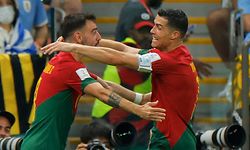 Portugal's forward #07 Cristiano Ronaldo (R) celebrates with Portugal's midfielder #08 Bruno Fernandes after he scored his team's first goal during the Qatar 2022 World Cup Group H football match between Portugal and Uruguay at the Lusail Stadium in Lusail, north of Doha on November 28, 2022. (Photo by Odd ANDERSEN / AFP)