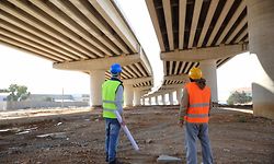 Two construction workers or engineers.