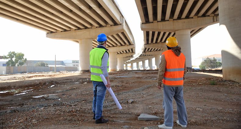 Two construction workers or engineers.