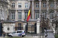 The Belgian flag flies at half-mast at the Palais de la Nation near the Wetstraat (Rue de la Loi) which was evacuated after an explosion at the Maalbeek subway station in Brussels on March 22, 2016.
European countries vowed to defend democracy against terrorism after blasts at Brussels airport and in the EU's institutional heart left at least 26 dead and dozens injured. / AFP / Belga / NICOLAS MAETERLINCK / Belgium OUT
