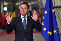 Luxembourg's Prime Minister Xavier Bettel reacts as journalists shout upon his arrival at the European Council in Brussels on October 17, 2018. - British Prime Minister Theresa May is due to address a summit of European Union leaders in which Brexit negotiations are expected to be top of the agenda. (Photo by Ben STANSALL / AFP)