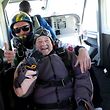 103-year-old Rut Larsson from Mj�lby and her tandem partner Joackim Johansson from Link�ping's parachute club pose for a picture before their jump in Motala, Sweden, on May 29, 2022. - The 103-year-old Swedish woman set the world record for the oldest person to complete a tandem parachute jump, saying she planned to celebrate "with a little cake". Larsson, who is 103 years and 259 days old, beat the previous record of 103 years and 181 days. (Photo by Jeppe GUSTAFSSON / TT News Agency / AFP) / Sweden OUT