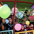 Palestinian children ride a train during an event organised by Hamas movement ahead of the Eid al-Fitr holiday marking the end of the holy Muslim fasting month of Ramadan, in Rafah, in the southern Gaza Strip, on June 24, 2017. / AFP PHOTO / SAID KHATIB