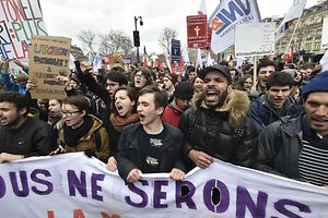 Paris university students called by youth organizations demonstrate at Place de la Republique in Paris on March 9, 2016, to protest the government's planned deeply unpopular labour reforms. The left placard reads : "Utopians, stand up ! Let's fight together until the end !". France faced a wave of protests today against deeply unpopular labour reforms that have divided an already-fractured Socialist government and raised hackles in a country accustomed to iron-clad job security. AFP PHOTO / DOMINIQUE FAGET