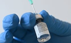 (FILES) In this file photo taken on January 10, 2021 a health worker fills a syringe with the Pfizer-BioNTech COVID-19 vaccine against the novel coronavirus at the vaccination center in Pfaffenhofen, southern Germany. - Pfizer-Biontech's coronavirus vaccine offers more protection than earlier thought with effectiveness in preventing symptomatic disease reaching 97 percent, according to real world evidence published on March 11, 2021 by the pharmaceutical companies. (Photo by Christof STACHE / AFP)