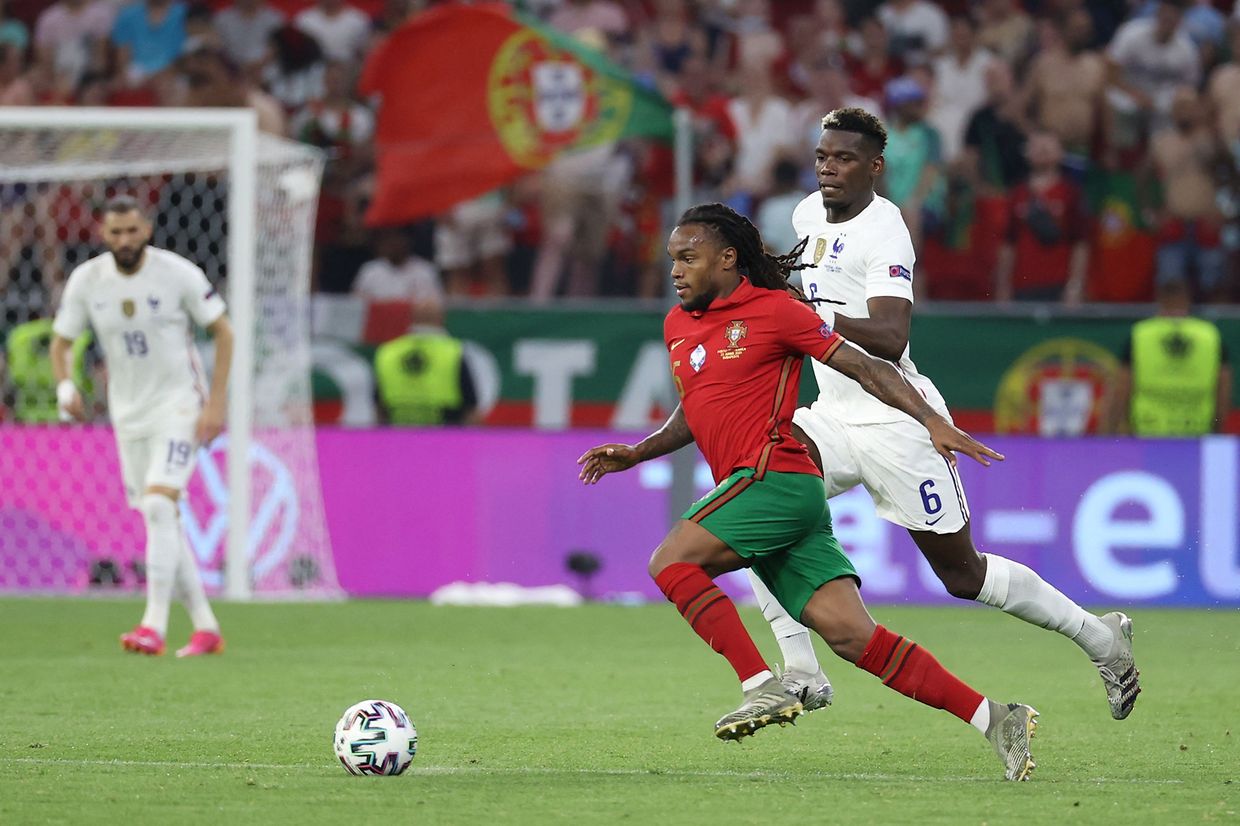 Portugal's midfielder Renato Sanches (L) fights for the ball with France's midfielder Paul Pogba during the UEFA EURO 2020 Group F football match between Portugal and France at Puskas Arena in Budapest on June 23, 2021. (Photo by BERNADETT SZABO / POOL / AFP)