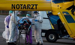 Medical staff carry a patient on a gurney towards a German medical helicopter on a parking lot beside Mercy hospital CHR in Metz-Thionville, eastern France, to be evacuated to a German hospital, on March 23, 2020,  on the seventh day of a lockdown aimed at curbing the spread of the COVID-19 (novel coronavirus) in France.



A general view shows the "Place de la comedie" in the city of Montpellier on March 23, 2020, in the south of France, since a strict lock-out obliging most French people to stay at home came into force on March 17, 2020 A strict lock-out forcing most French people to stay at home came into effect at noon on March 17, 2020, prohibiting all outings, except essential, in order to curb the spread of the coronavirus. - Two patients are evacuated at the same time by two german medical helicopters. (Photo by JEAN-CHRISTOPHE VERHAEGEN / AFP)