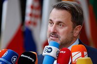 Luxembourg's Prime Minister Xavier Bettel speaks to media as he arrives for the second day of a EU leaders Summit at The European Council Building in Brussels on October 21, 2022. (Photo by Ludovic MARIN / AFP)