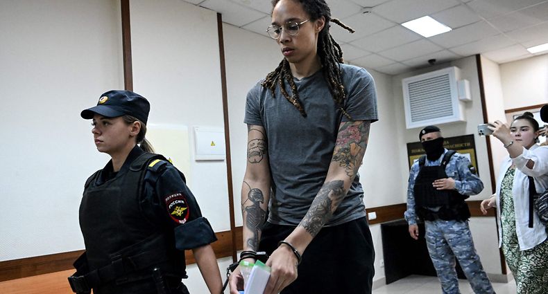 (FILES) In this file photo taken on August 4, 2022 US Women National Basketball Association's (WNBA) basketball player Brittney Griner, who was detained at Moscow's Sheremetyevo airport and later charged with illegal possession of cannabis, leaves the courtroom before the court's final decision in Khimki outside Moscow. - Moscow confirmed on December 8, 2022 it had exchanged US basketball star Brittney Griner, who had been jailed in Russia, for notorious arms trafficker Victor Bout who was serving a 25-year sentence in the United States. (Photo by Kirill KUDRYAVTSEV / POOL / AFP)