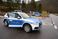 Police block the access to the site where two police officers were shot dead in the early morning during a routine patrol in Kusel, Rhineland-Palatinate, western Germany on January 31, 2022. - Two German police officers were shot dead on January 31 after pulling over a car during a routine traffic stop, prompting police to launch a major manhunt. The shooting happened at around 4:20 am in the Kusel district of western Rhineland-Palatinate state during a routine patrol. A 24-year-old female police officer and her 29-year-old male colleague were killed. Police are still searching for the fugitive perpetrators. (Photo by Thomas Frey / dpa / AFP) / Germany OUT