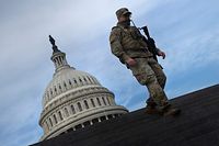 TOPSHOT - A member of the National Guard provides security at the US Capitol on January 14, 2021, in Washington, DC, a week after supporters of US President Donald Trump attacked the Capitol, and ahead of the inauguration of President-elect Joe Biden on January 20. (Photo by Brendan Smialowski / AFP)