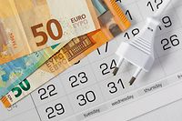 European power plug Type C and euro banknotes on the calendar. The concept of payment of accounts, tariff increase, the date of payment for electricity