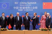 (L-R) Zhang Jianhua, China's Minister of Energy, China's Minister of State Administration of Market Regulation Zhang Mao, European Commission President Jean-Claude Juncker, Chinese Premier Li Keqiang, President of the European Council Donald Tusk, European Commissioner for Competition Margrethe Vestager and The European Commissioner for climate action and energy Miguel Arias Canete pose after a signature ceremony as part of a EU-China summit at the European council in Brussels, on April 9, 2019. (Photo by STEPHANIE LECOCQ / POOL / AFP)