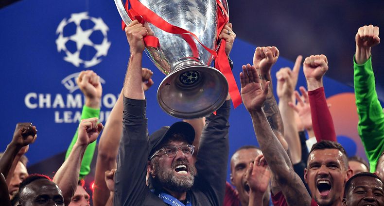 (FILES) In this file photo taken on June 1, 2019 Liverpool's German manager Jurgen Klopp (C) raises the trophy after winning the UEFA Champions League final football match between Liverpool and Tottenham Hotspur at the Wanda Metropolitano Stadium in Madrid. - Twelve of Europe's most powerful clubs announced the launch of a breakaway European Super League on April 19, 2021 in a potentially seismic shift in the way football is run, but faced accusations of greed and cynicism. Six Premier League teams, Liverpool, Manchester United, Arsenal, Chelsea, Manchester City and Tottenham are involved, alongside Real Madrid, Barcelona, Atletico Madrid, Juventus, Inter Milan and AC Milan. Real Madrid chief Florentino Perez, who was announced as the first ESL president, said the breakaway reflected the big clubs' wishes. (Photo by Ben STANSALL / AFP)