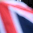 A member of the media shelters from the rain beneath a Union flag themed umbrella, outside 11 Downing Street, the official residence of British Chancellor of the Exchequer Philip Hammond, in London, on March 8, 2017.
Hammond will unveil his latest tax and spend plans Wednesday in a budget expected to exude caution as the country prepares to trigger Brexit. / AFP PHOTO / Justin TALLIS