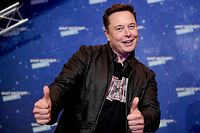 (FILES) In this file photo taken on December 1, 2020 SpaceX owner and Tesla CEO Elon Musk poses as he arrives on the red carpet for the Axel Springer Awards ceremony, in Berlin. - The fortunes of the world's ten richest men have doubled since the start of the pandemic while the incomes of 99% of humanity have shrunk, according to an Oxfam report on Monday, January 17. (Photo by Britta Pedersen / POOL / AFP)