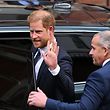 Britain's Prince Harry, Duke of Sussex waves as he leaves from the Royal Courts of Justice, Britain's High Court, in central London on March 27, 2023. - Prince Harry and pop superstar Elton John appeared at a London court Monday, delivering a high-profile jolt to a privacy claim launched by celebrities and other figures against a newspaper publisher. The publisher of the Daily Mail, Associated Newspapers (ANL), is trying to end the high court claims brought over alleged unlawful activity at its titles. (Photo by JUSTIN TALLIS / AFP)