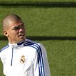 Real Madrid's Pepe from Portugal looks around during a training session in Madrid Monday Oct. 18, 2010. Real Madrid will play AC Milan Tuesday in a Group G Champions League soccer match. (AP Photo/Paul White)