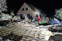 This handout photograph released on October 24, 2022, by the local firefighter department Service departemental d'incendie et de secours (SDIS 62) shows a firefighter inspecting damages in Bihucourt, northern France, after a tornado hit the region. (Photo by SDIS 62� / AFP) / RESTRICTED TO EDITORIAL USE - MANDATORY CREDIT "AFP PHOTO / SDIS 62" - NO MARKETING NO ADVERTISING CAMPAIGNS - DISTRIBUTED AS A SERVICE TO CLIENTS