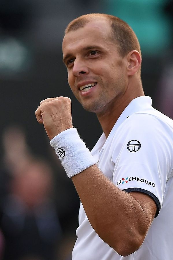 Luxembourg's Gilles Muller reacts after winning against Spain's Rafael Nadal during their men's singles fourth round match on the seventh day of the 2017 Wimbledon Championships at The All England Lawn Tennis Club in Wimbledon, southwest London, on July 10, 2017.
Muller won the match 6-3, 6-4, 3-6, 4-6, 15-13. / AFP PHOTO / Glyn KIRK / RESTRICTED TO EDITORIAL USE