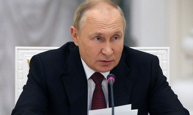 Russian President Vladimir Putin chairs a meeting at the Kremlin in Moscow on Tuesday