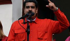 Venezuela's President Nicolas Maduro (C), speaks to a crowd of supporters to announce his is breaking off diplomatic ties with the United States, during a gathering in Caracas on January 23, 2019. - Venezuela President Nicolas Maduro announced on Wednesday he was breaking off diplomatic ties with the United States after counterpart Donald Trump acknowledged opposition leader Juan Guaido as the South American country's "interim president." (Photo by Luis ROBAYO / AFP)