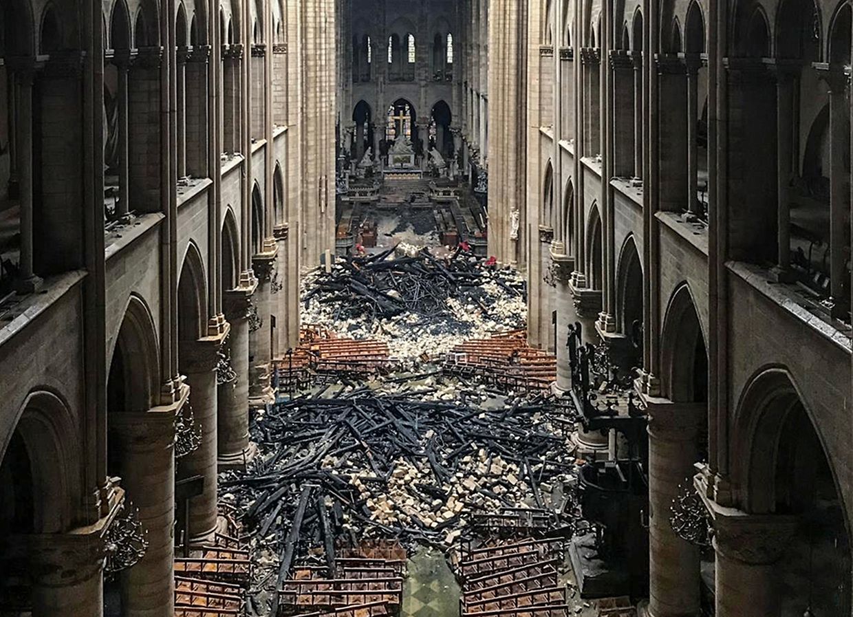 (FILES) This file photo taken on April 16, 2019 shows an interior view of the Notre-Dame Cathedral in Paris in the aftermath of a fire that devastated the cathedral. - April 15, 2021 marks the two years anniversary of the fire that devastated Notre-Dame-de-Paris Cathedral, in the centre of the French capital. (Photo by - / AFP)