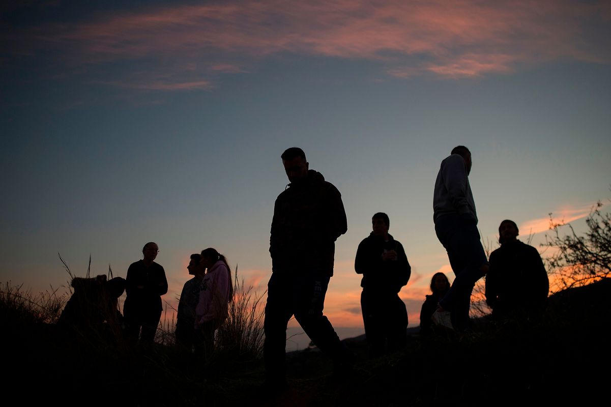 People gather as rescue workers continue efforts to find a boy who fell down a well in Totalan in southern Spain on January 16, 2019. - Rescuers racing to save a two-year-old boy who fell down a well in southern Spain have found several strands of his hair, authorities said, raising hopes of finding the toddler whose fate has gripped the nation for days. It is the first confirmation that Julen is down the 110-metre (360-foot) deep shaft after family members said he tumbled in while playing as his parents had lunch nearby. (Photo by JORGE GUERRERO / AFP)