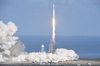The SpaceX Falcon Heavy takes off from Pad 39A at the Kennedy Space Center in Florida, on February 6, 2018, on its demonstration mission.
The world's most powerful rocket, SpaceX's Falcon Heavy, blasted off Tuesday on its highly anticipated maiden test flight, carrying CEO Elon Musk's cherry red Tesla roadster to an orbit near Mars. Screams and cheers erupted at Cape Canaveral, Florida as the massive rocket fired its 27 engines and rumbled into the blue sky over the same NASA launchpad that served as a base for the US missions to Moon four decades ago.
 / AFP PHOTO / JIM WATSON