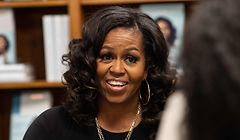 (FILES) In this file photo taken on November 18, 2019, former US First Lady Michelle Obama meets with fans during a book signing on the first anniversary of the launch of her memoir "Becoming" at the Politics and Prose bookstore in Washington, DC. - Michelle Obama will debut as a podcaster later this month on Spotify, hosting a show aimed at helping listeners open new and "hard conversations" with their loved ones. The first episode will drop July 29, 2020, and is available exclusively to all Spotify free and premium users. (Photo by NICHOLAS KAMM / AFP)