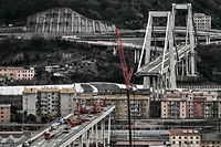 TOPSHOT - A general view shows technicians set up material and work on the western section of the remains of the Morandi bridge (Bottom L) in Genoa, on February 7, 2019, on the eve of the official start of the demolition work of the first meters of the western section of the bridge. (Photo by Marco BERTORELLO / AFP)