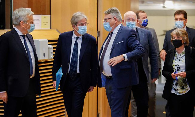 EU Commissioner for Jobs and Social Rights Nicolas Schmit (centre) speaks with EU Economy Commissioner Paolo Gentiloni (second from left) as they and other top EU leaders meet in Brussels on Wednesday