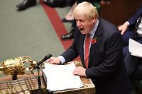 A handout picture released by the UK Parliament shows shows Britain's Prime Minister Boris Johnson speaking in the House of Commons in London on October 29, 2019, during a debate on the Early Parliamentary General Election Bill: Second Reading. - Britain was on course for a December election Tuesday after the main opposition Labour party said it would support Prime Minister Boris Johnson's plan, although a date has not yet been fixed. Labour leader Jeremy Corbyn said: "I have consistently said that we are ready for an election and our support is subject to a 'no deal' Brexit being off the table." (Photo by JESSICA TAYLOR / various sources / AFP) / RESTRICTED TO EDITORIAL USE - MANDATORY CREDIT " AFP PHOTO / UK PARLIAMENT / Jessica Taylor " - NO USE FOR ENTERTAINMENT, SATIRICAL, MARKETING OR ADVERTISING CAMPAIGNS - EDITORS NOTE THE IMAGE HAS BEEN DIGITALLY ALTERED AT SOURCE TO OBSCURE VISIBLE DOCUMENTS / 