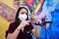 Licensed Vocational Nurse Eloisa Flores prepares a dose of Johnson & Johnson's Covid-19 vaccine at a vaccination clinic in Los Angeles, California on December 15, 2021. (Photo by Frederic J. BROWN / AFP)
